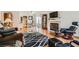 Cozy living room features a fireplace, hardwood floors, and modern furnishings at 5401 Bugle Way # 103, Las Vegas, NV 89108