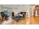 Bright living room boasts hardwood floors and a vaulted ceiling at 5401 Bugle Way # 103, Las Vegas, NV 89108