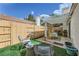Cozy outdoor patio featuring modern furniture, shaded pergola, and artificial turf for easy maintenance at 5401 Bugle Way # 103, Las Vegas, NV 89108