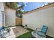 Private patio with easy-care artificial turf, providing a serene outdoor retreat for relaxation and enjoyment at 5401 Bugle Way # 103, Las Vegas, NV 89108