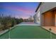 Enjoy a putting green and basketball court in this home's backyard at 6056 Willow Rock St, Las Vegas, NV 89135