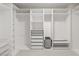 Bright and spacious walk-in closet featuring custom shelving and plenty of space for clothes and storage at 6056 Willow Rock St, Las Vegas, NV 89135