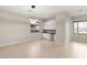 Spacious dining room with modern lighting, two large windows that let in lots of natural light at 6056 Willow Rock St, Las Vegas, NV 89135