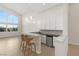 Stylish kitchen with granite countertops, stainless steel appliances, and a breakfast bar with seating at 6056 Willow Rock St, Las Vegas, NV 89135