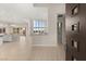 An expansive open-concept living space with a gourmet kitchen, dining area, and modern furnishings, creating an inviting atmosphere at 6056 Willow Rock St, Las Vegas, NV 89135