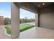 Covered patio view of putting green and basketball court, perfect for entertaining at 6056 Willow Rock St, Las Vegas, NV 89135