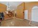 The entryway showcases high ceilings, stylish tile flooring, and leads into the open-concept kitchen, and living areas at 619 Zalataia Way, North Las Vegas, NV 89031