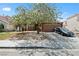 Charming single-story home with a well-maintained lawn, mature trees, and a two-car garage, situated in a friendly neighborhood at 619 Zalataia Way, North Las Vegas, NV 89031