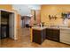 Open kitchen featuring ample counter space, modern appliances, and seamless flow into the living area, perfect for entertaining guests at 619 Zalataia Way, North Las Vegas, NV 89031