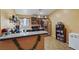 Well-lit functional kitchen with ample cabinet space, updated appliances, and a breakfast bar for casual dining at 619 Zalataia Way, North Las Vegas, NV 89031