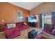 Comfortable living room with vaulted ceiling, a comfortable seating arrangement, and natural light creating a welcoming atmosphere at 619 Zalataia Way, North Las Vegas, NV 89031