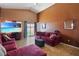Spacious living room with vaulted ceiling, a comfortable seating arrangement, and natural light creating a welcoming atmosphere at 619 Zalataia Way, North Las Vegas, NV 89031