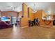 Bright and airy open living room with tiled floor perfect for both relaxing and entertaining guests at 619 Zalataia Way, North Las Vegas, NV 89031