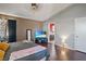 Spacious main bedroom with hardwood floors and ensuite bathroom access at 619 Zalataia Way, North Las Vegas, NV 89031