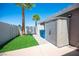Storage shed and artificial grass area in the backyard at 6417 Fisher Ave, Las Vegas, NV 89130