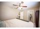 A bedroom with a metal bed frame next to a walk-in closet at 6417 Fisher Ave, Las Vegas, NV 89130