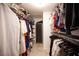 Walk-in closet with well-organized shelving and hanging rods for ample storage and organization at 6417 Fisher Ave, Las Vegas, NV 89130