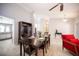 The dining room has a dark wood table with seating for six at 6417 Fisher Ave, Las Vegas, NV 89130