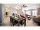 Bright and airy dining area with modern lighting and neutral tile flooring at 6417 Fisher Ave, Las Vegas, NV 89130