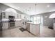 Bright kitchen with stainless steel appliances and a center island at 6417 Fisher Ave, Las Vegas, NV 89130