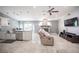 Open-concept living space with a fireplace and access to an outdoor patio at 6417 Fisher Ave, Las Vegas, NV 89130