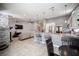 Spacious living area with fireplace and open to kitchen with breakfast bar at 6417 Fisher Ave, Las Vegas, NV 89130