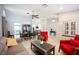 An open-concept living and dining area with neutral decor and lots of light at 6417 Fisher Ave, Las Vegas, NV 89130