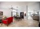 Bright, open-concept living and dining area with tile flooring and neutral decor at 6417 Fisher Ave, Las Vegas, NV 89130