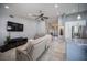 Spacious living room featuring tile floors, neutral tones, and modern ceiling fan at 6417 Fisher Ave, Las Vegas, NV 89130