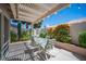 Cozy covered patio with outdoor seating, perfect for relaxing and entertaining guests at 6417 Fisher Ave, Las Vegas, NV 89130