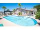 Sparkling pool with gazebo, patio, and lush landscaping, perfect for outdoor entertaining at 6417 Fisher Ave, Las Vegas, NV 89130