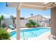 Refreshing pool with lounge chairs and desert landscaping offers a private outdoor oasis at 6417 Fisher Ave, Las Vegas, NV 89130