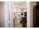 A walk-in closet with wire shelving, dresser, and hanging clothes at 6417 Fisher Ave, Las Vegas, NV 89130