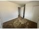 Bedroom with neutral carpet and double closet at 7282 Quarterhorse Ln, Las Vegas, NV 89148