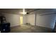 Garage with ample storage space and access door at 7282 Quarterhorse Ln, Las Vegas, NV 89148