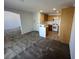 Open-concept kitchen with wood cabinetry and white appliances, with views to living area at 7282 Quarterhorse Ln, Las Vegas, NV 89148