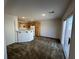 Open living space with wood cabinets and sliding glass door at 7282 Quarterhorse Ln, Las Vegas, NV 89148