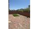Private backyard featuring a patio area with artificial grass at 7499 Lodano Ave, Las Vegas, NV 89113