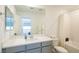 Contemporary bathroom featuring a sleek vanity with a large mirror and a shower-tub combo at 7499 Lodano Ave, Las Vegas, NV 89113