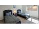 Cozy bedroom with two twin beds, a nightstand, and soft lighting for a relaxing atmosphere at 7499 Lodano Ave, Las Vegas, NV 89113