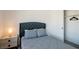 Simple bedroom features a soft bed, carpeted floors, and a closet with sliding doors for easy access at 7499 Lodano Ave, Las Vegas, NV 89113