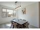 Dining area with wood floors and natural light from a window at 7499 Lodano Ave, Las Vegas, NV 89113