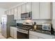 Close up of a stainless steel gas range and oven in the kitchen at 7499 Lodano Ave, Las Vegas, NV 89113