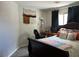 Cozy bedroom featuring a bed, dark furniture, decor art, and a window with black out curtains at 7812 Sedalia St, Las Vegas, NV 89139