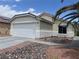 Charming single-story home with a two-car garage, desert landscaping, and well-maintained exterior at 7812 Sedalia St, Las Vegas, NV 89139