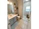 Well-lit bathroom with a vanity, toilet, shower, and modern fixtures at 8340 Winterchase Pl, Las Vegas, NV 89143