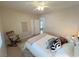 Cozy bedroom with ceiling fan, a comfortable bed, and natural light at 8340 Winterchase Pl, Las Vegas, NV 89143