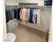 Walk-in closet offering ample storage space with hanging rods and shelving for clothing at 8340 Winterchase Pl, Las Vegas, NV 89143
