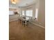 Dining area featuring a large table, seating, and ample natural light at 8340 Winterchase Pl, Las Vegas, NV 89143