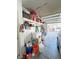 Spacious garage offering ample storage solutions with overhead shelving and room for parking at 8340 Winterchase Pl, Las Vegas, NV 89143